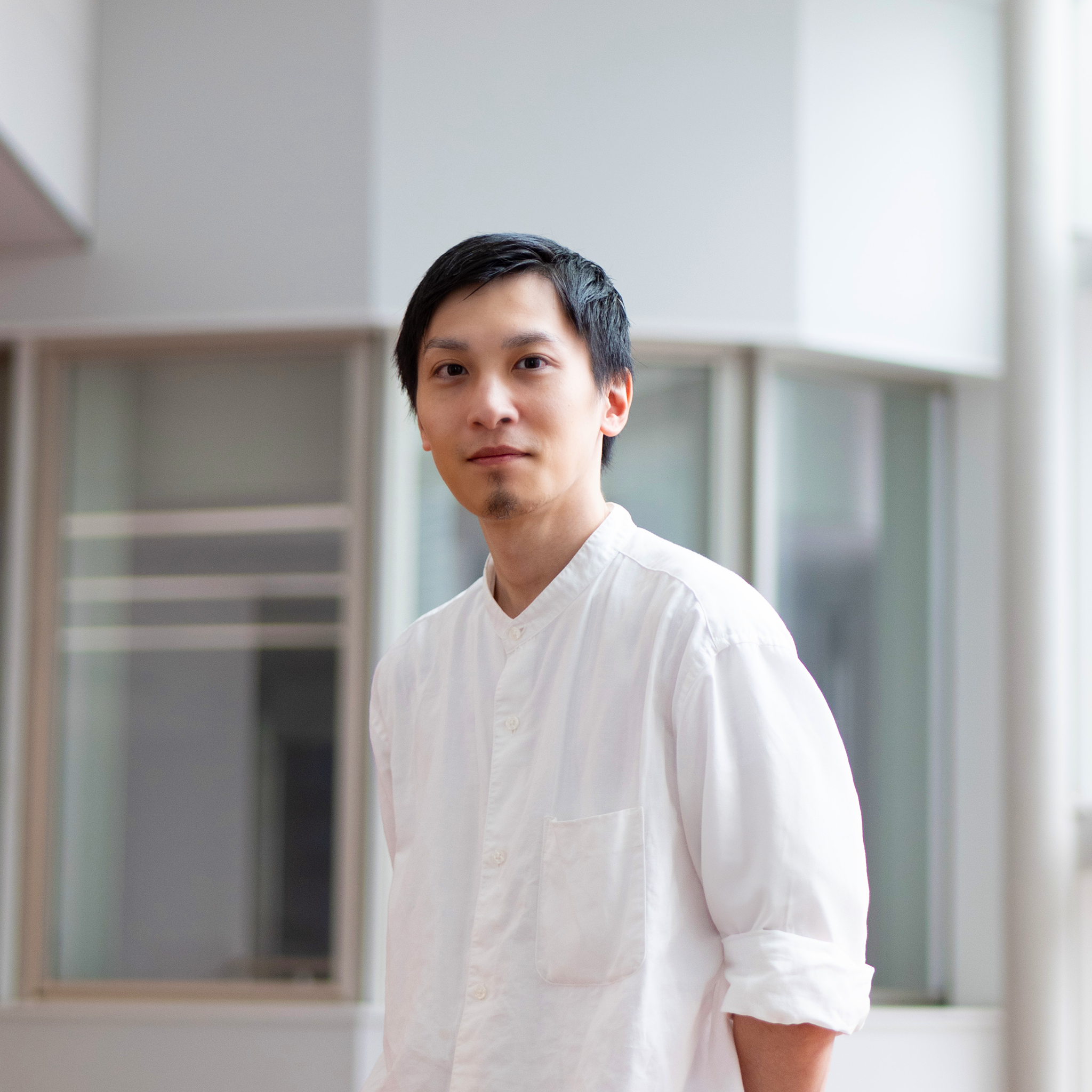 Tomoki Ishibashi's portrait: A man with white Mao-collar shirt